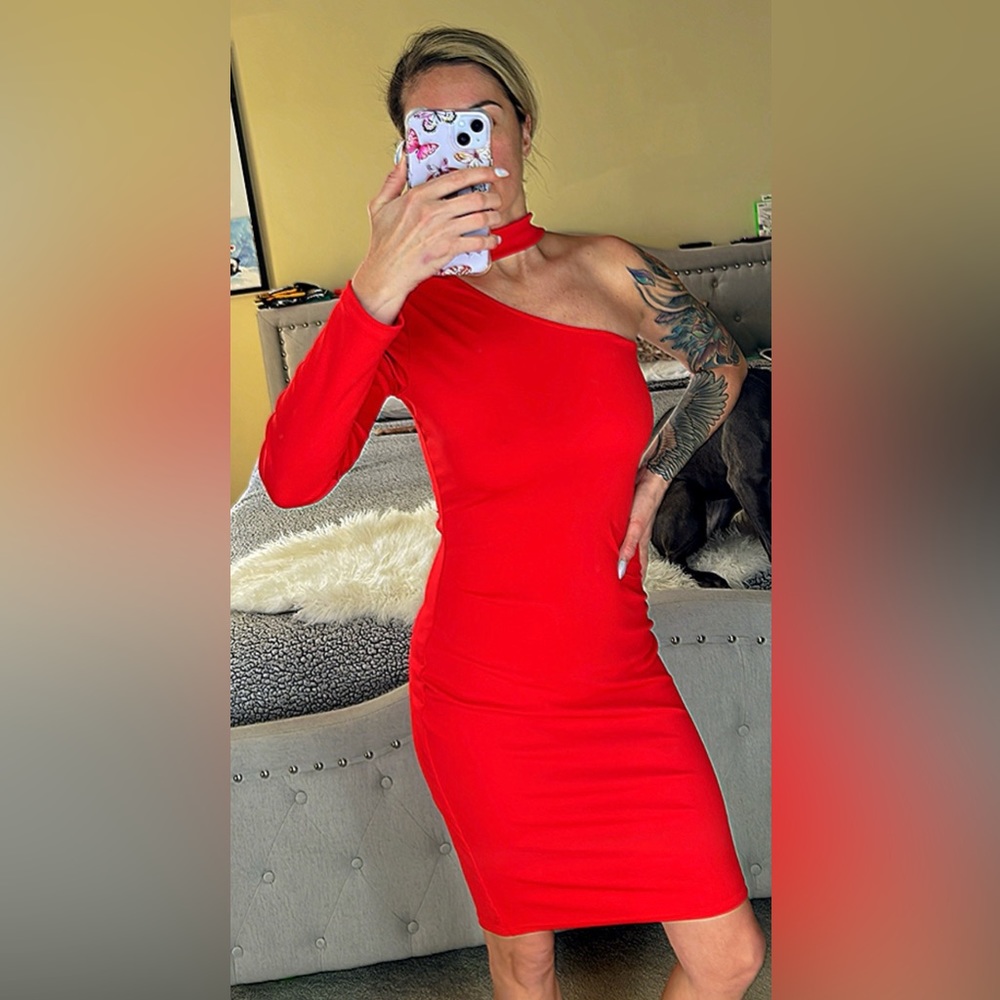 Red cocktail/holiday dress. 1 shoulder with long sleeve. Form fitting, stretchy